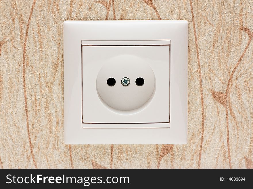White electrical outlet and wall plate. European socket.
