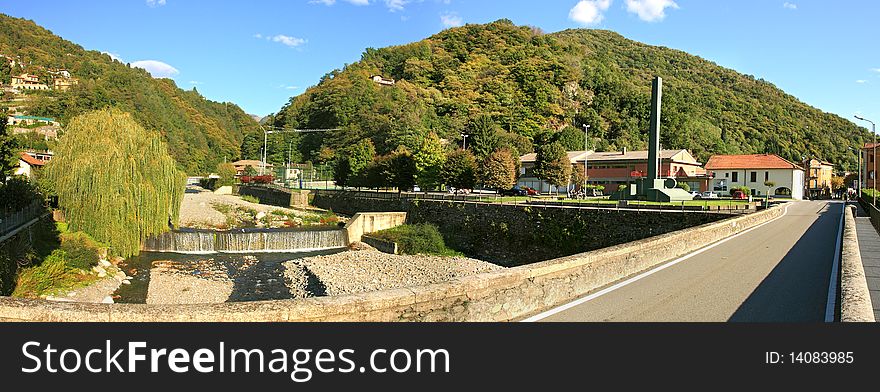 Panoramic view on green hills, small village, river and road in Switzerland. Panoramic view on green hills, small village, river and road in Switzerland.