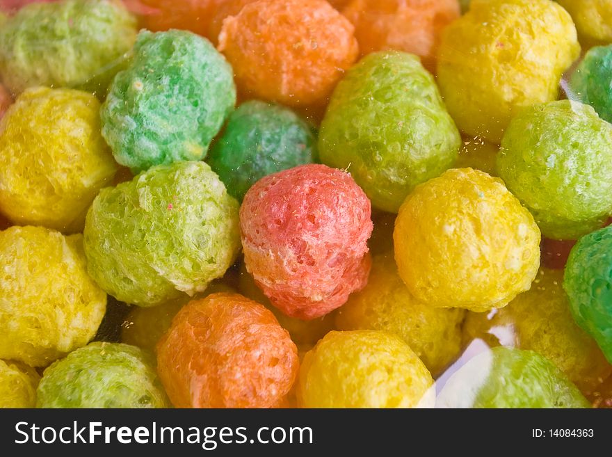 Colourful snack ball for feeding fish.