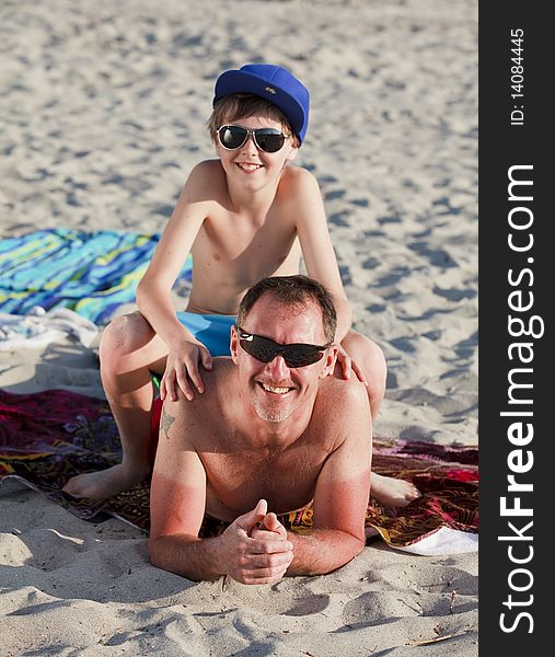 Father and Son Enjoying one of Miami's Beautiful Beaches. Father and Son Enjoying one of Miami's Beautiful Beaches.