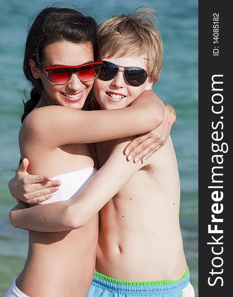 Teenagers Hugging on the Beach