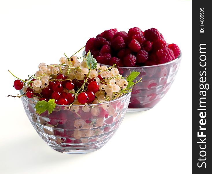 Fresh Raspberry and currant isolated on white background