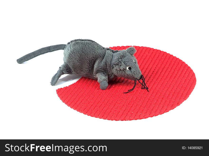 Mouse toy on the red carpet computer. White background