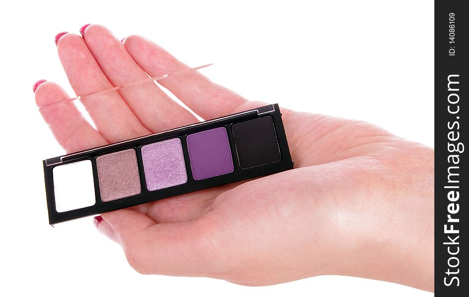 Eyeshadow in human hand with white background