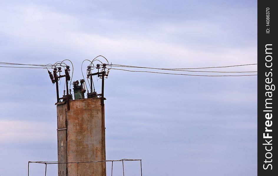 The old transformer against the sky