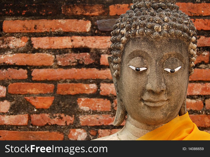 Buddha image head in the old temple in Ayudhaya, Thailand