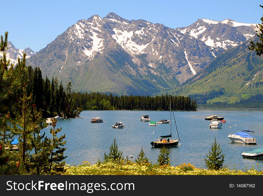 Boats on a lake with beautiful moutains in background. Boats on a lake with beautiful moutains in background