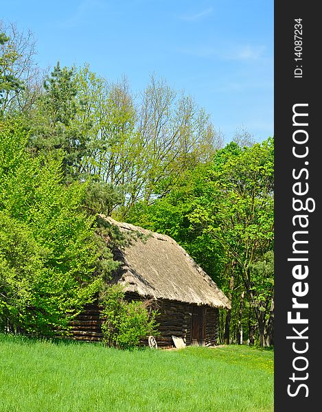 Old house with roof from straw in forest, cottage from Czech republic. Old house with roof from straw in forest, cottage from Czech republic