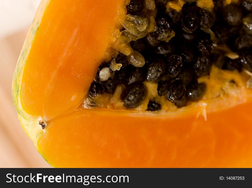 Papaya Fruit On The Wooden Background