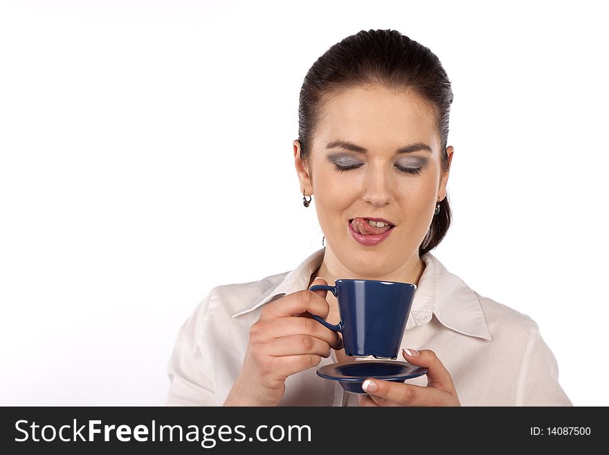 A young woman enjoying a cup of coffee. A young woman enjoying a cup of coffee