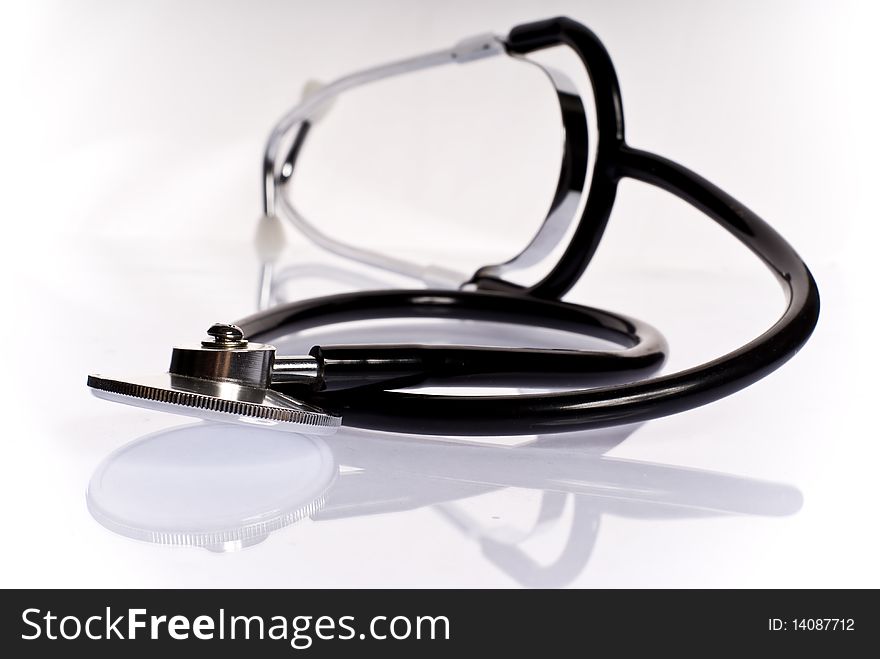 Medical stethoscope on white background