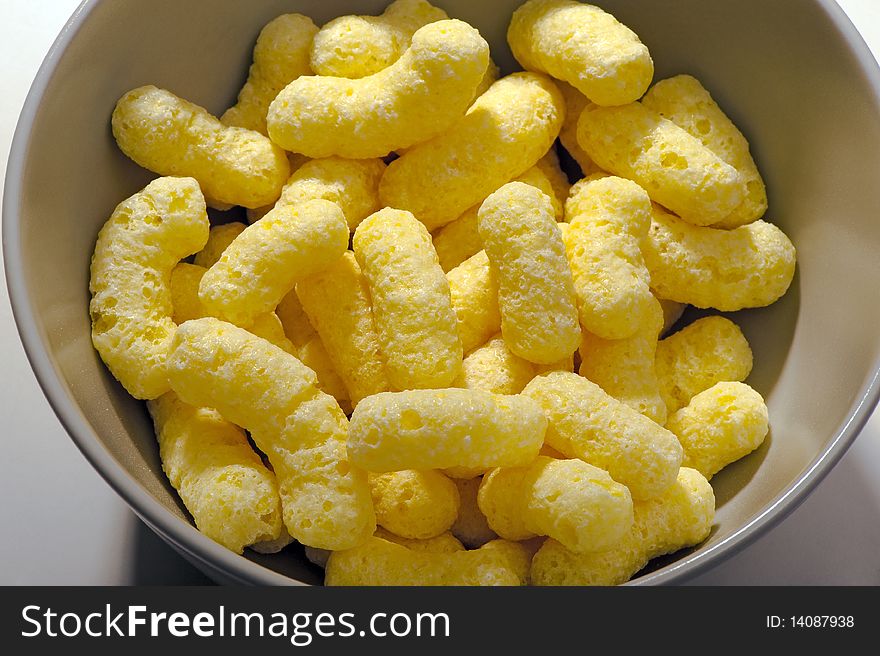 Corn sticks in a bowl close-up