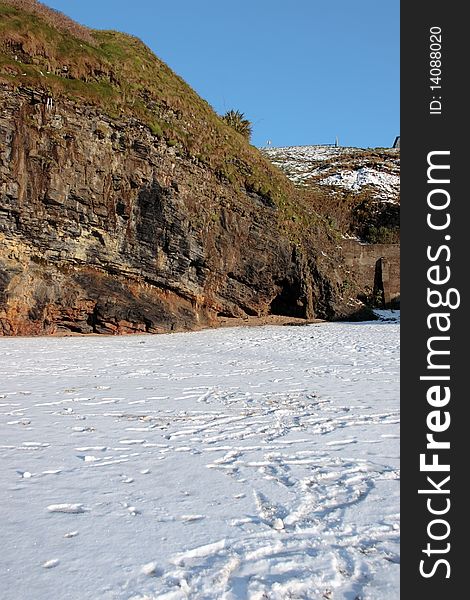 Empty rocky beach cliffs on a cold winters day