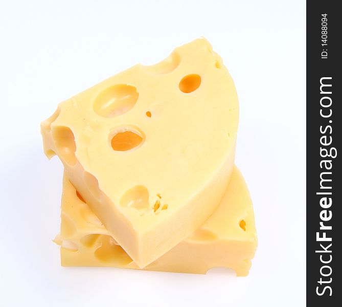 Two pieces of cheese on white background