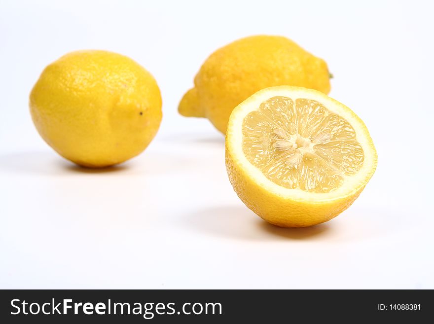 Two and a half lemons on white background