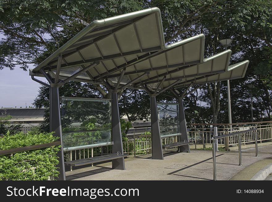 Structural steel modern designed bus stop with cantilevered metal roof. Structural steel modern designed bus stop with cantilevered metal roof