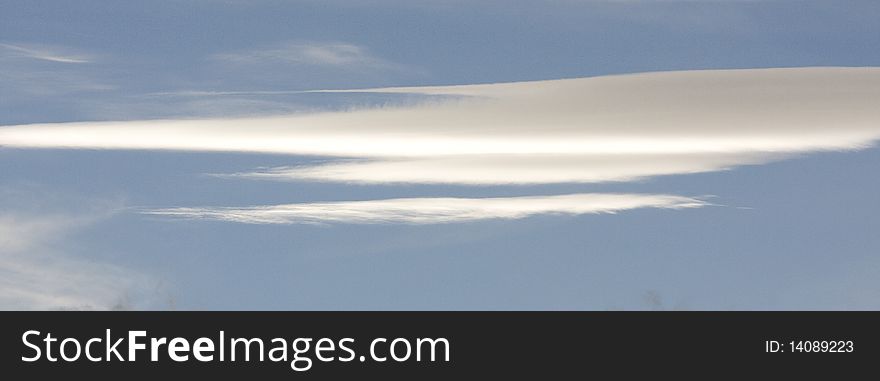 Lenticular cloud formation in blue sky