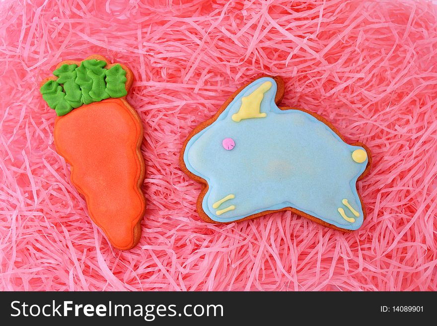 Close up of easter cookies on pink ribbons as background.