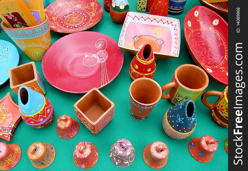 Colored ceramic objects on green background