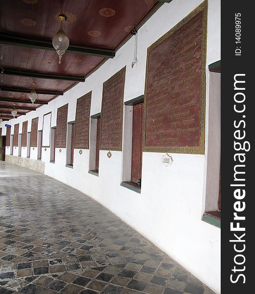 The corridor of the temple in Thailand with the words of the Bhudha. The corridor of the temple in Thailand with the words of the Bhudha