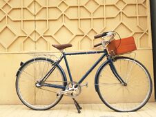 Beautiful Retro Bicycle Set Against A Wall And Equipped With A Wooden Box To Carry Stuff Stock Photography