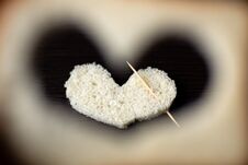 Hearts Carved From A Piece Of Bread On A Wooden Table Stock Image