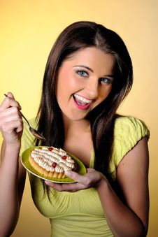 Young Beautiful Girl Eating Small Sweet Cake Stock Photo Young Beautiful Girl Eating Small Sweet Cake Stock Photo