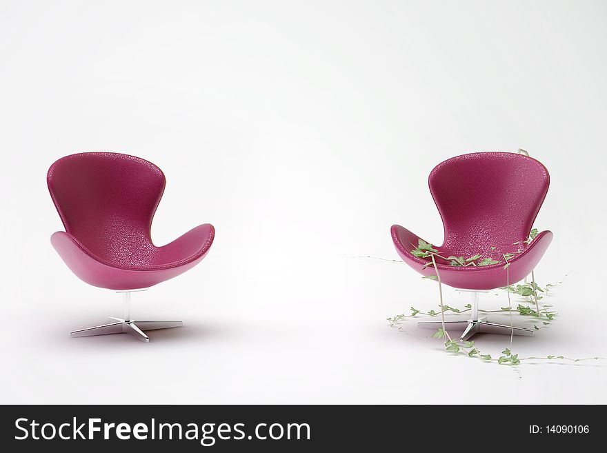 Two purple leather chair entwined with ivy on a white background