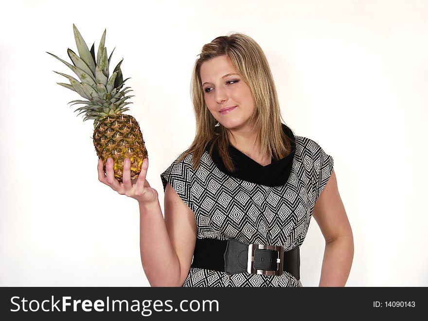 Portrait of the woman holding pineapple in the hand. Portrait of the woman holding pineapple in the hand