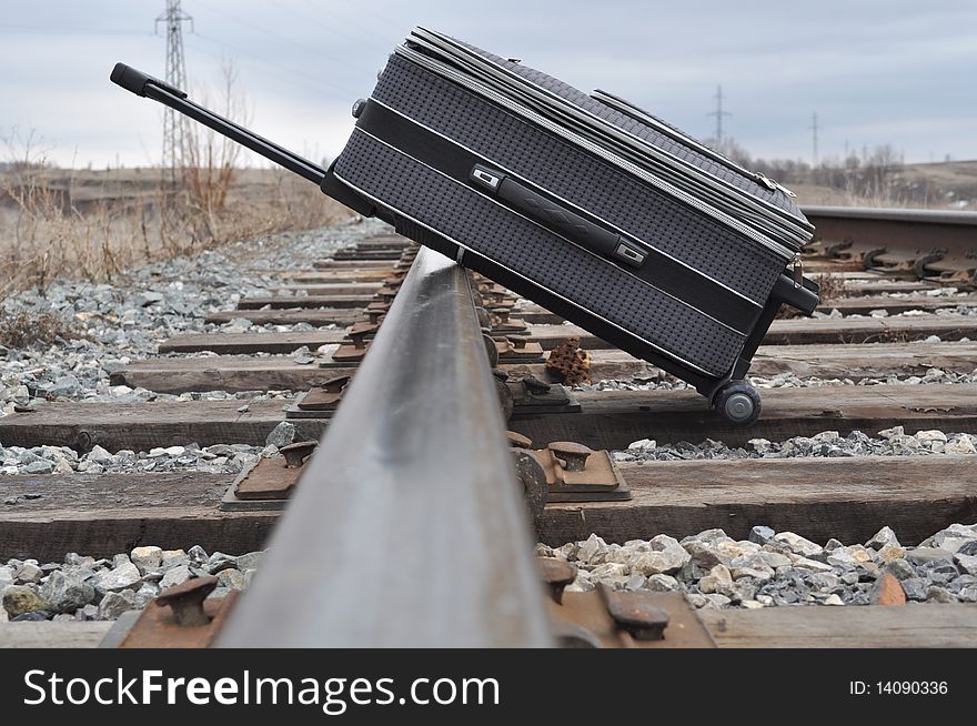 She was lying on railroad tracks, has a handle, the foreground is blurred, wooden sleepers. She was lying on railroad tracks, has a handle, the foreground is blurred, wooden sleepers