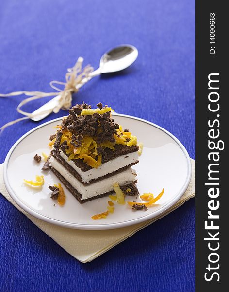 Chocolate cake with orange and bizet on plate