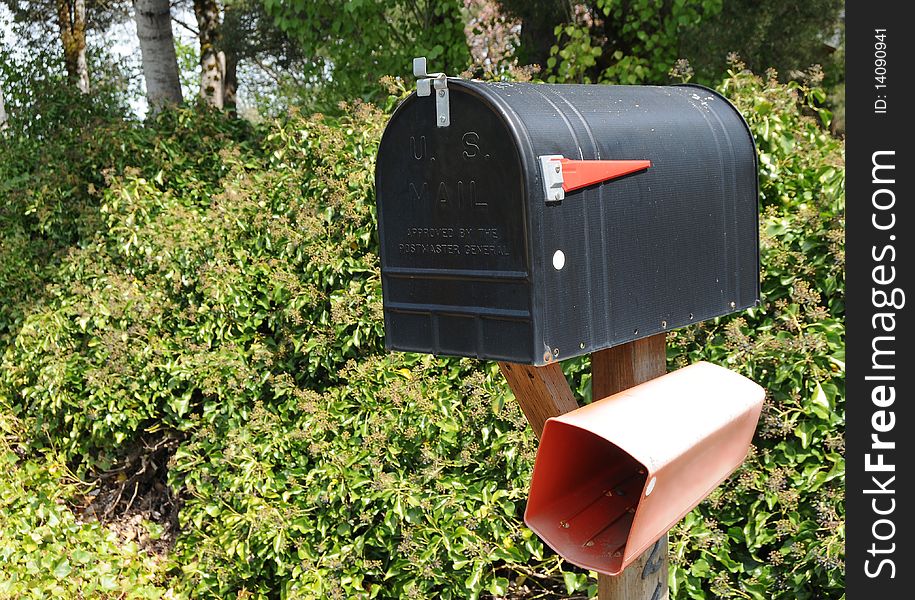 Closed black mail box that says U.S. Mail on the front. Closed black mail box that says U.S. Mail on the front