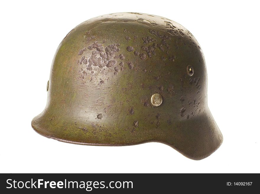 Old German fashists helmet of times of the second Great world war on a white background with clipping path. Old German fashists helmet of times of the second Great world war on a white background with clipping path.
