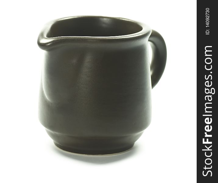 Small ceramic brown jug isolated. Small ceramic brown jug isolated