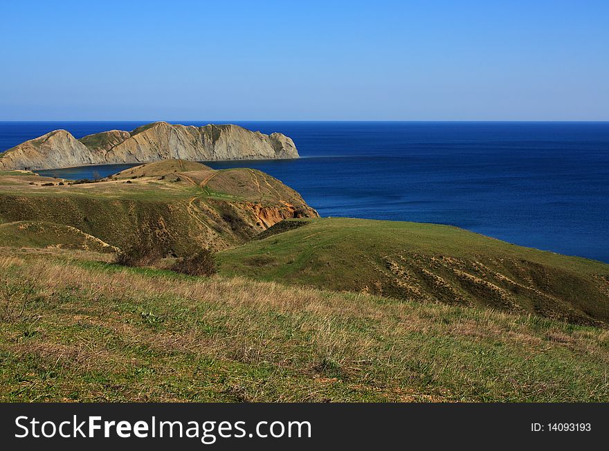 Mountain and sea landscape east of crimea. Soft, folded mountains without forests. Mountain and sea landscape east of crimea. Soft, folded mountains without forests