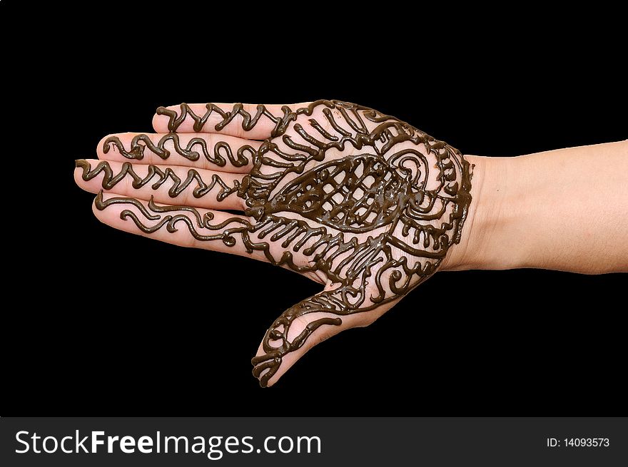 A design on hands against a black  background