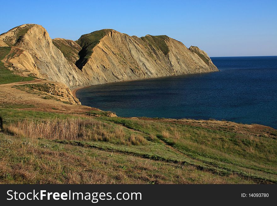 Mountain and sea landscape east of crimea. Soft, folded mountains without forests. Mountain and sea landscape east of crimea. Soft, folded mountains without forests