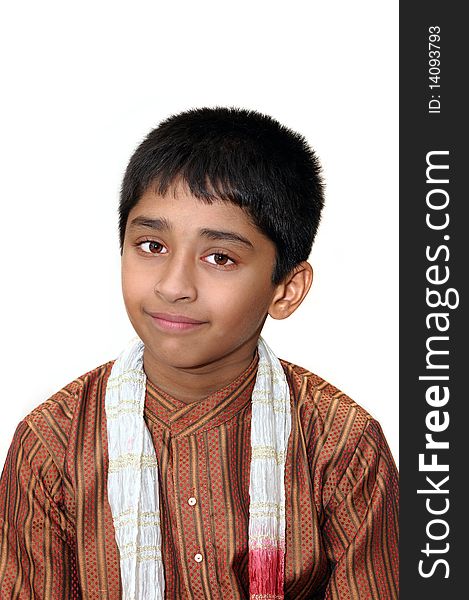An handsome Indian kid dressed very traditionally