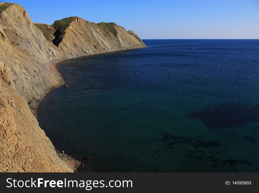 Mountain and sea landscape east of crimea. Soft, folded mountains without forests. Mountain and sea landscape east of crimea. Soft, folded mountains without forests