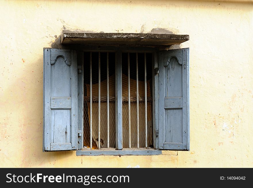 An old window on an overcast tropical summer