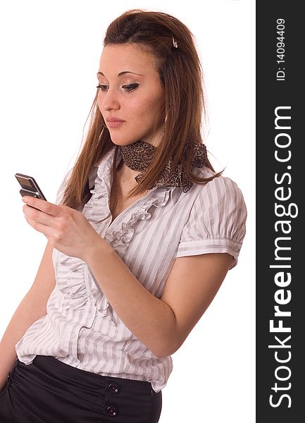 A young women sending a text message isolated on a white background. A young women sending a text message isolated on a white background.