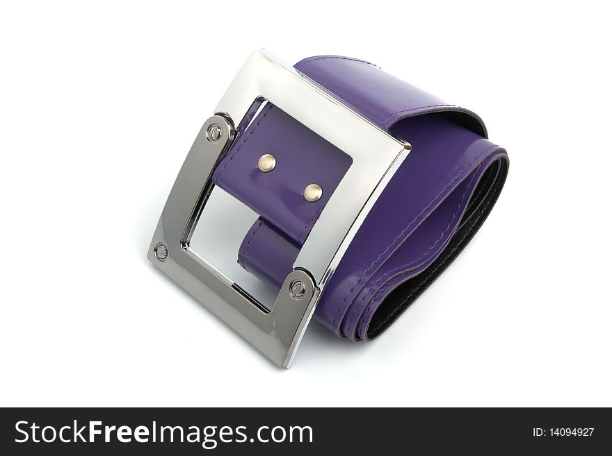 Metal buckle and purple belt isolated on white. Metal buckle and purple belt isolated on white