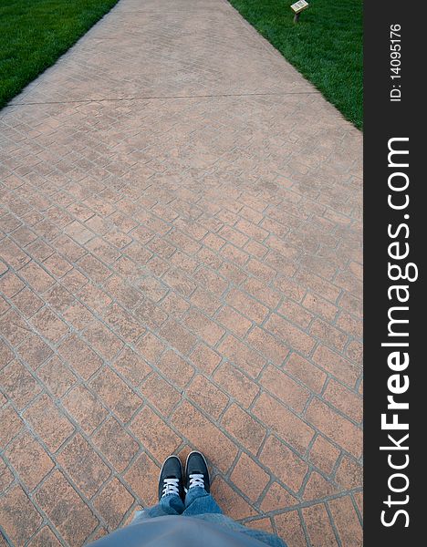 Walking on a red brick path in a park. Walking on a red brick path in a park