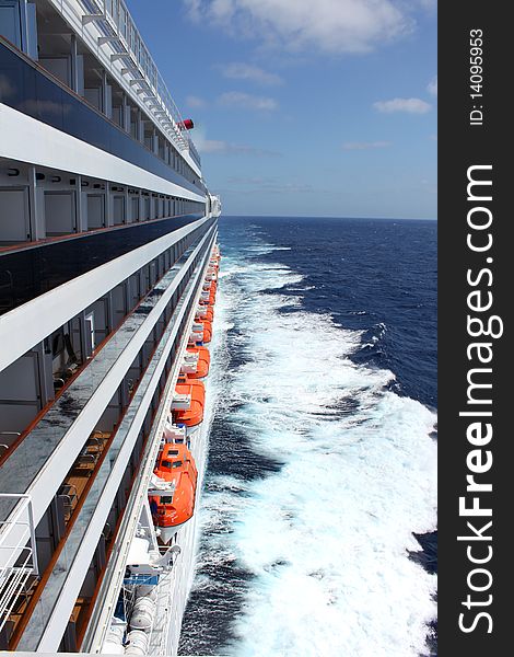 Cruise ship in the ocean with waves and clear water