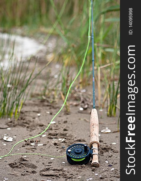 Fly fishing trip on the lake - tackle on the sand