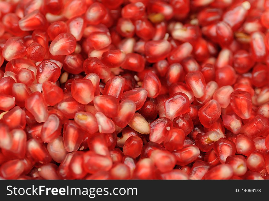 Close up shot of fresh and juicy seeds in a pomegranate