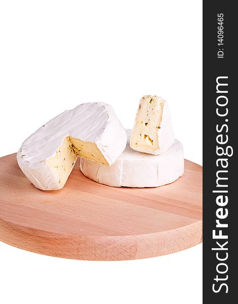 Camembert round cheese on wooden board. Camembert round cheese on wooden board.