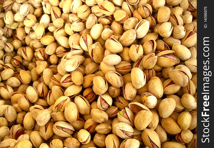 A pile of pistachios on a  fruit market