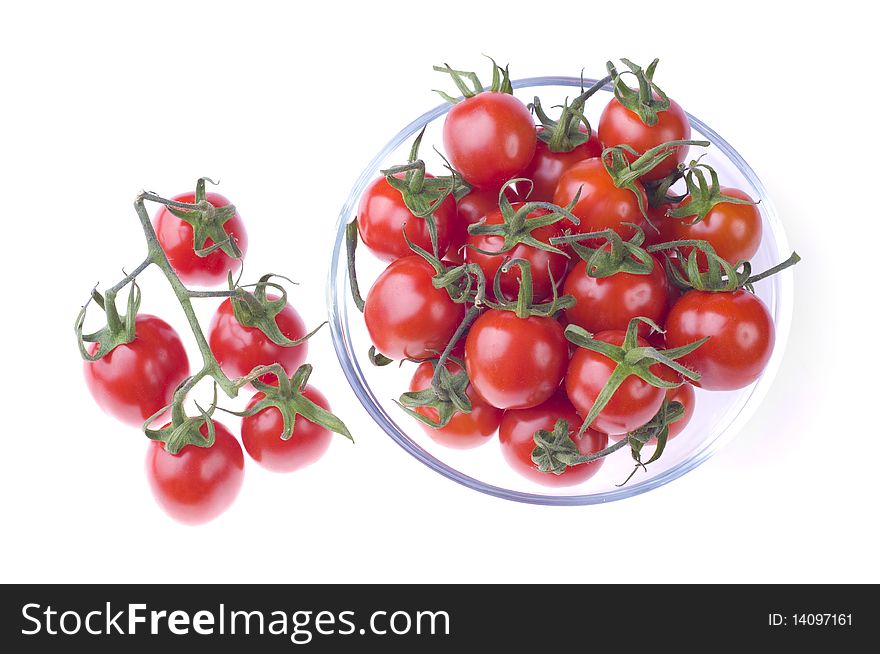 Pot of cherry tomatoes on white background