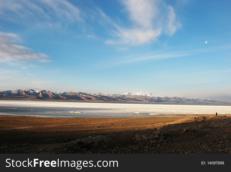 Snow mountains and freezing lake in Tibet,early in the morning. Snow mountains and freezing lake in Tibet,early in the morning